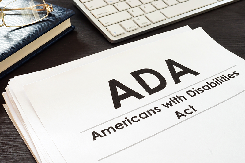 stack of legal documents with the heading of ADA, Americans with Disabilities Act